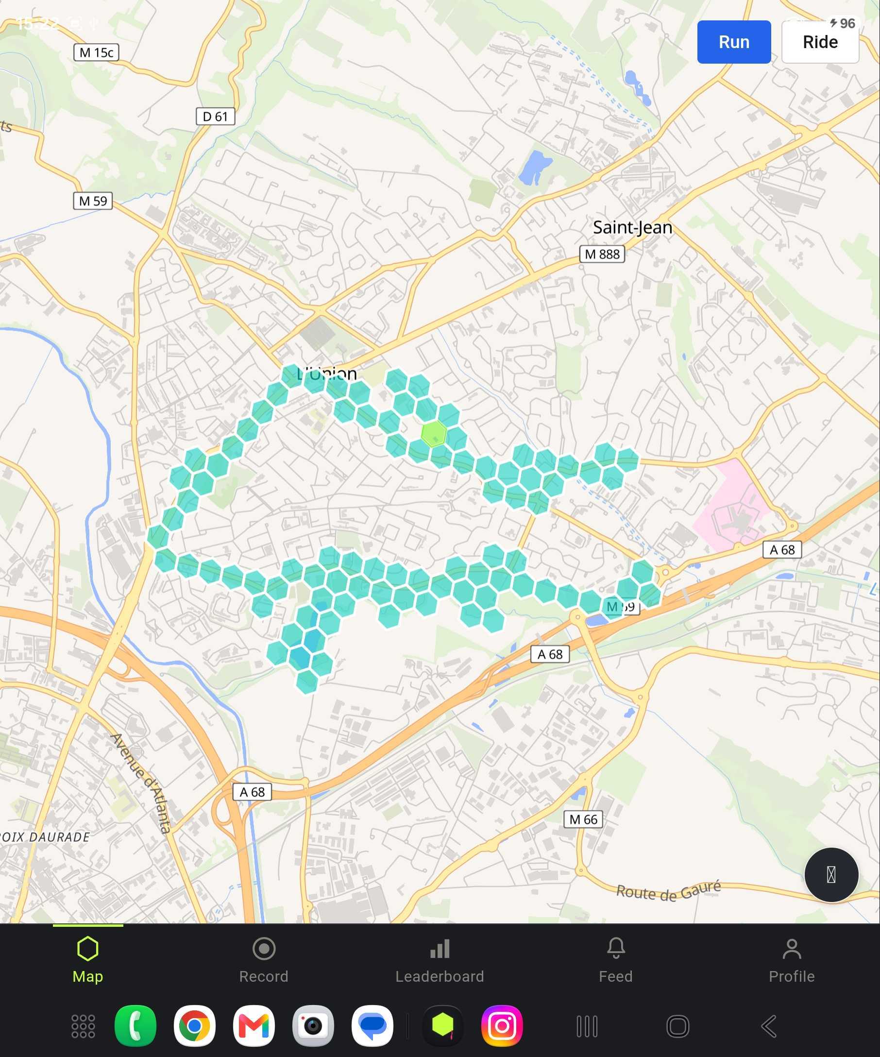 OpenTurf territory map showing captured hexagonal cells over a real street map